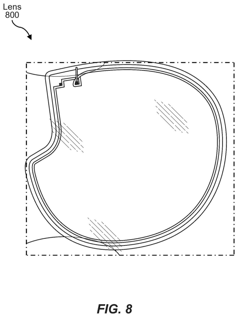Outline of an eyeglass lens containing embedded transparent circuitry. Drawing from patent filing US 2026/0236098 A1.