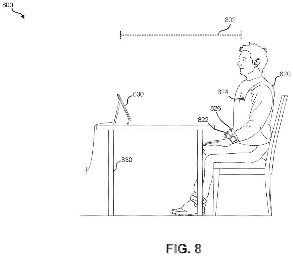 A person sits at a table with a smart display and a smartwatch, demonstrating a blood pressure measurement setup. Drawing from patent filing US 2026/0283485 A1.